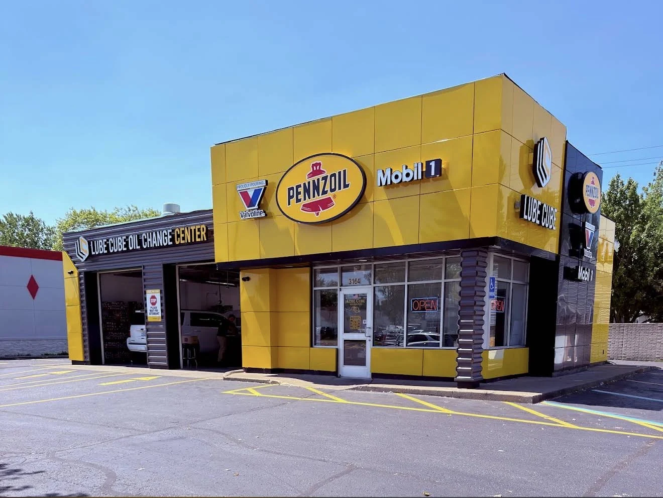 Lube Cube’s distinctive black-and-yellow storefront on Dix Highway